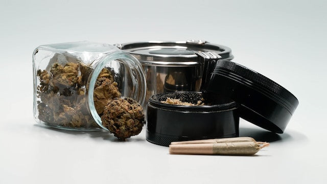 cannabis flower stored in a variety of jars
