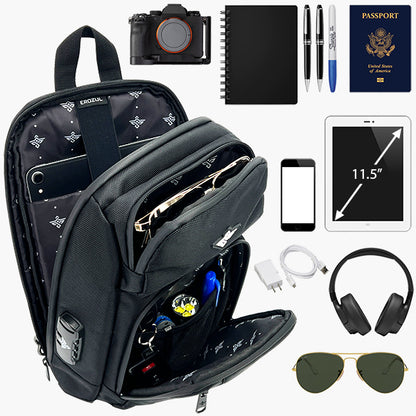 Open black Equinox Smell Proof Sling Bag With Combination Lock by Erozul, neatly organized and surrounded by travel essentials like a camera, notebook, pens, passport, tablet, phone, charger, headphones, and sunglasses.
